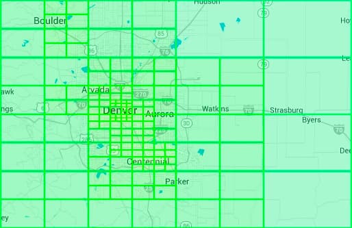 Image represents a geographical map, likely of the Denver, Colorado area, overlaid with a grid of large, bright green rectangular cells.  The cells form a coarse-grained partition of the map, covering a wide region encompassing cities such as Boulder, Arvada, Denver, Aurora, Centennial, Parker, Watkins, Strasburg, and Byers.  Major highways \(indicated by numbers like 70, 25, 270, etc.\) and smaller roads are visible within the cells, along with bodies of water depicted in light blue.  City names are labeled, providing geographical context. The grid's purpose appears to be a spatial partitioning scheme, possibly for data sharding, load balancing, or geographic data organization in a system design context.  The size and arrangement of the cells suggest a deliberate, possibly hierarchical, division of the area, with a finer-grained grid apparent in the Denver/Aurora area, indicating potentially higher data density or processing needs in that region.